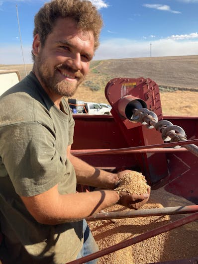 Daniel Stelzer with hulless spelt from the combine
