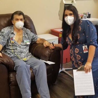 Doc in IV Room recliner at Envita with nurse