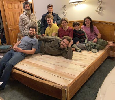 Ethan shows the bed-frame he made for his parents.